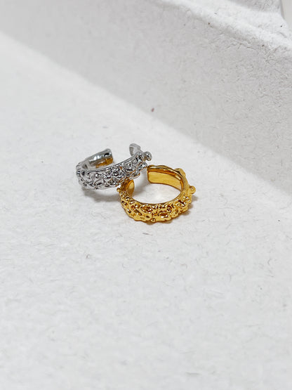 Close-up of the Molten Ridge sculptural ear cuff revealing the molten-like gold finish.