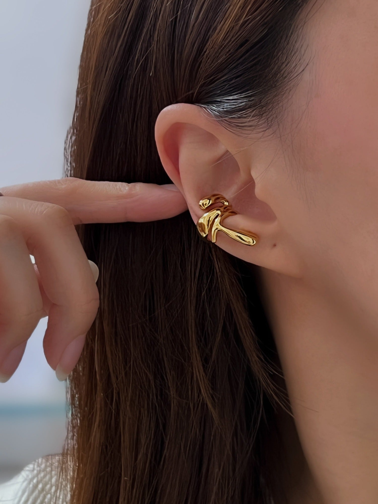 Fashion model wearing the Dylan cuff as a standalone statement ear accessory.