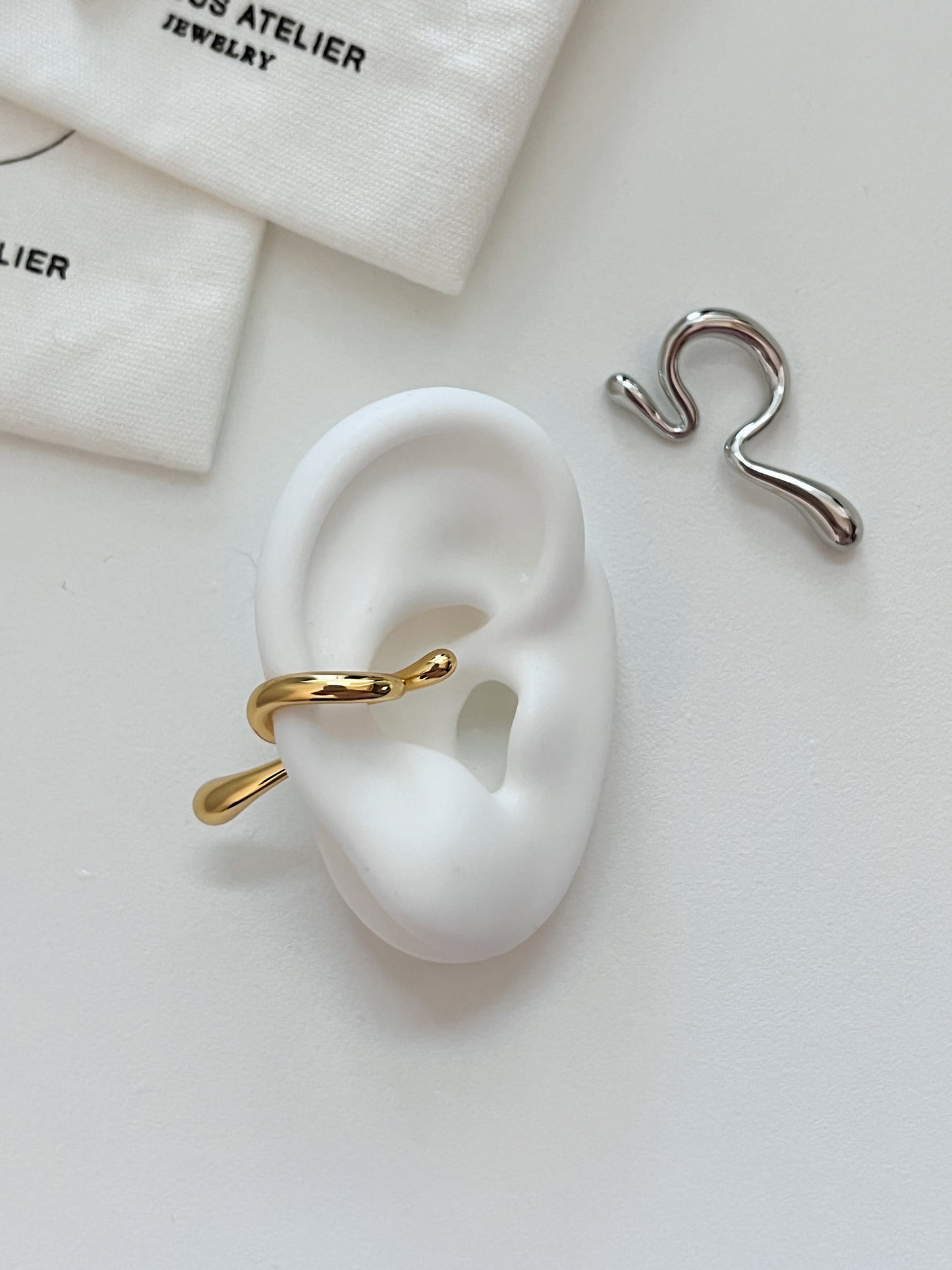 [Aurous Atelier] Tia abstract sculptural ear cuff in 18K gold and industrial silver.