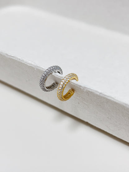 Side view of the S925 hallmark on the interior of the gold pavé cuff.