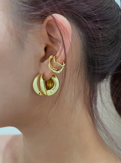 Side profile of model with Ashley Silver Cuff in a professional stack.