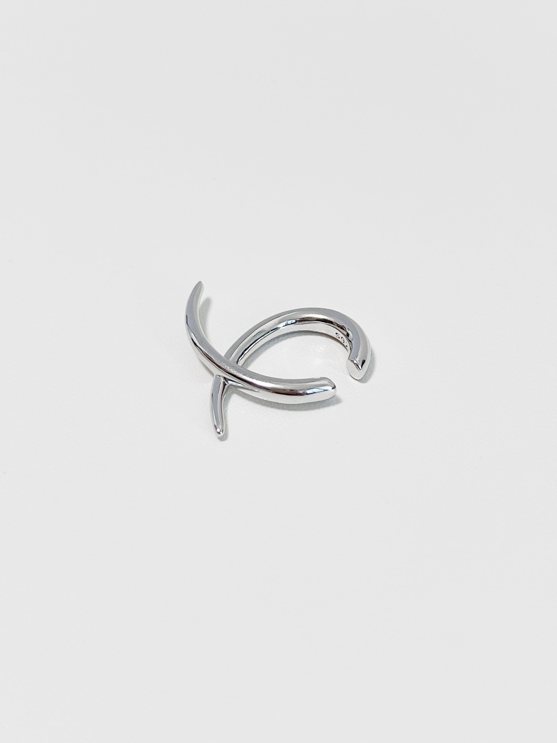 Side view of the Harley cuff showing the intersecting linear silhouette and polished finish.