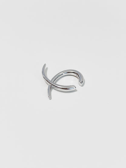 Side view of the Harley cuff showing the intersecting linear silhouette and polished finish.