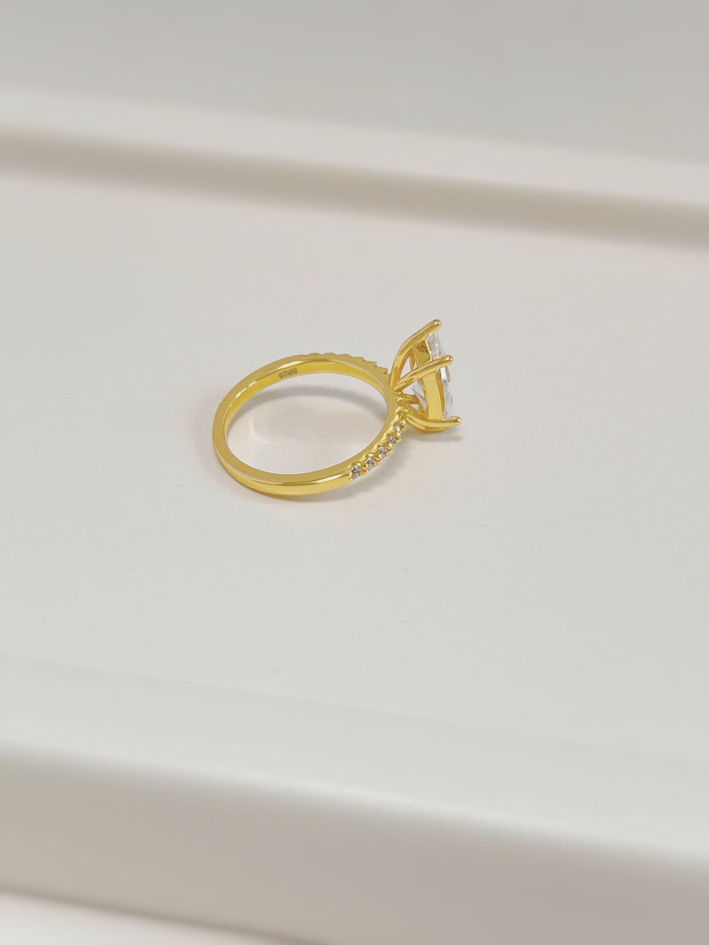 Side profile of 2-carat marquise moissanite setting on 18k gold vermeil band.