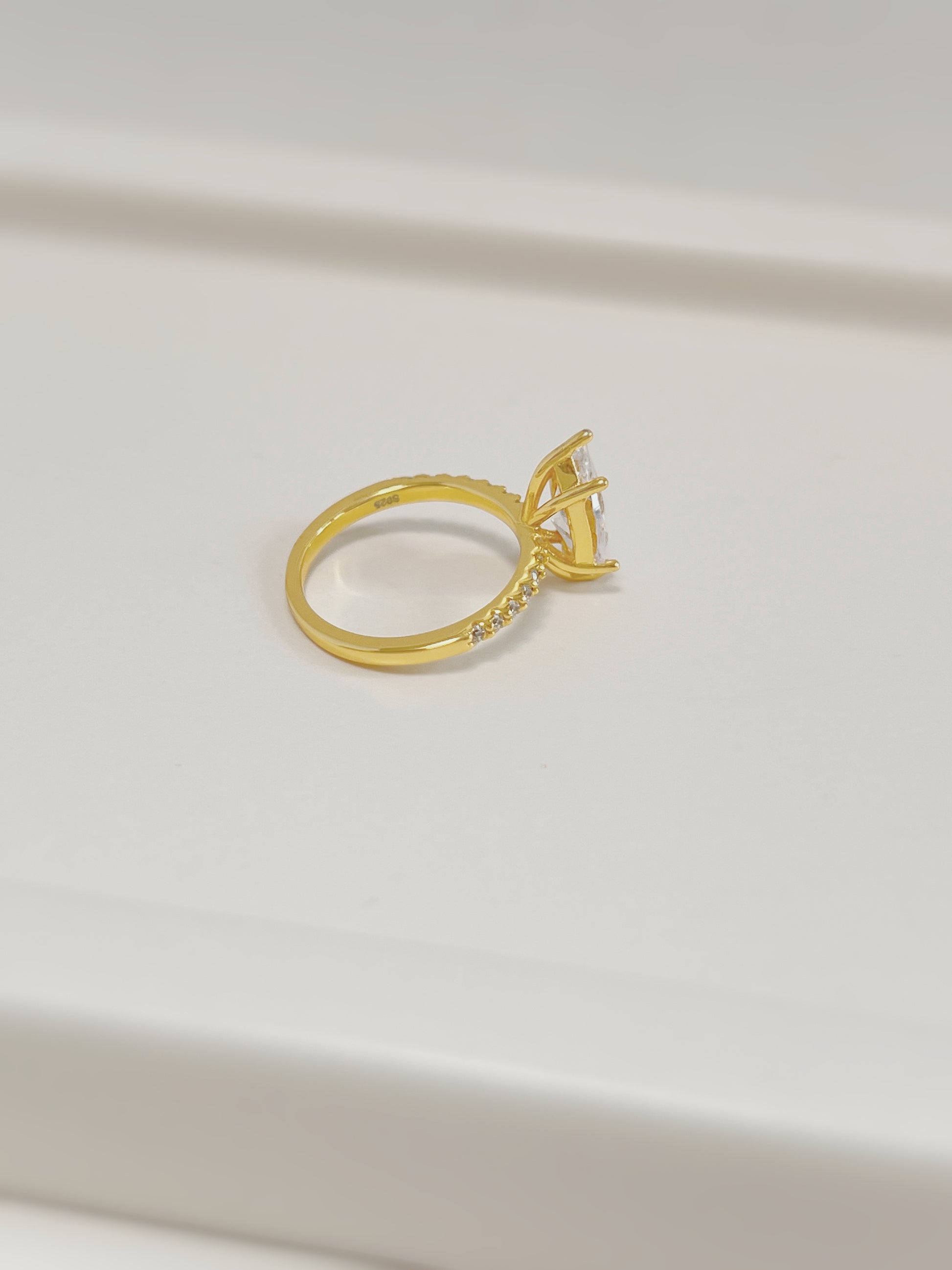 Side profile of 2-carat marquise moissanite setting on 18k gold vermeil band.