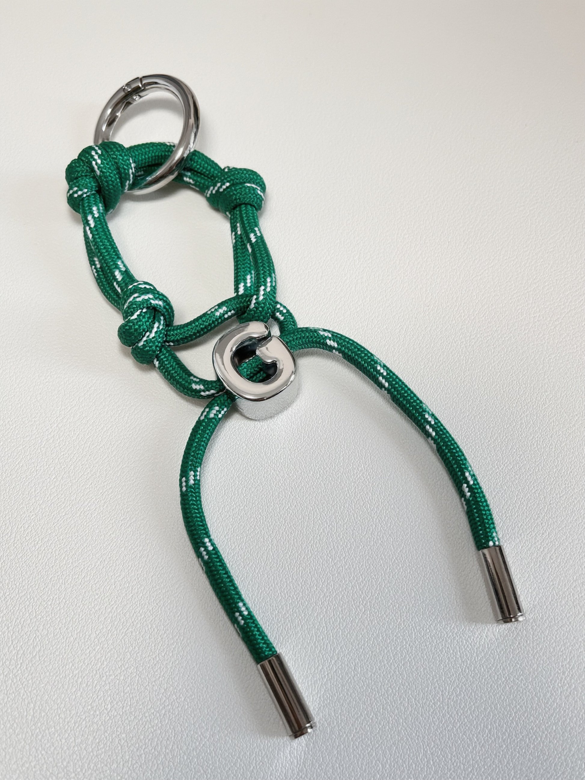 Close up perspective of tactical marine knotting on a premium paracord utility bag charm