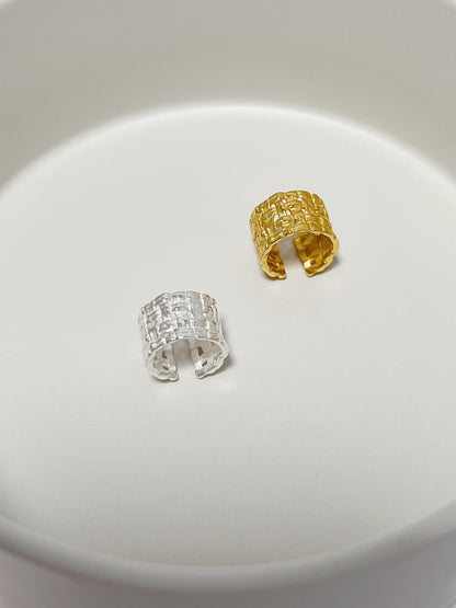 Top-down view of the 18K gold vermeil and sterling silver woven cuff showing the wide band and adjustable opening.