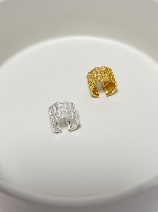 Top-down view of the 18K gold vermeil and sterling silver woven cuff showing the wide band and adjustable opening.