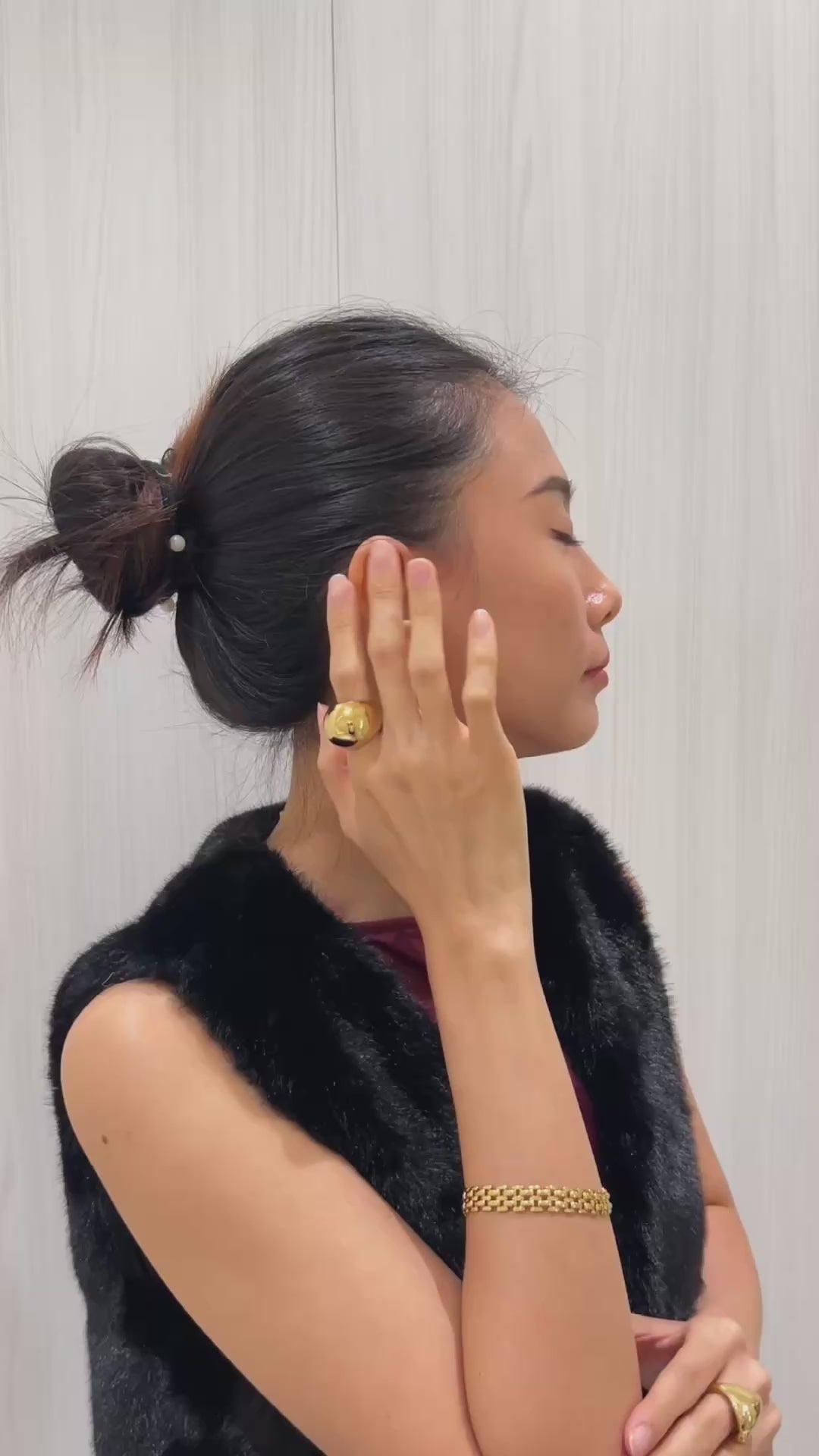 Model wearing Mylie hoops, sophisticated weave look.