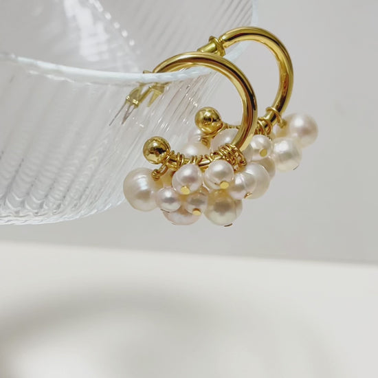 Macro detail of Freya cluster pearl hoop earrings, showcasing the hand-selected grade-A cultured pearl texture and s925 earring posts.