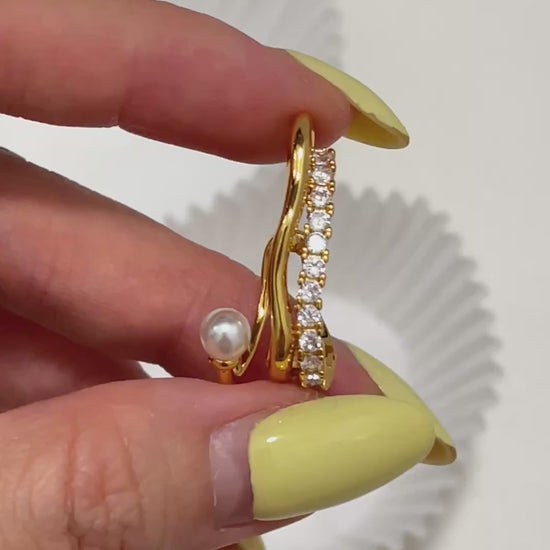 Detailed close-up angle of the dainty cassidy 18k Gold PVD Ear Cuff with a genuine round pearl and a row of shimmering cubic zirconia, displaying fine craftsmanship.