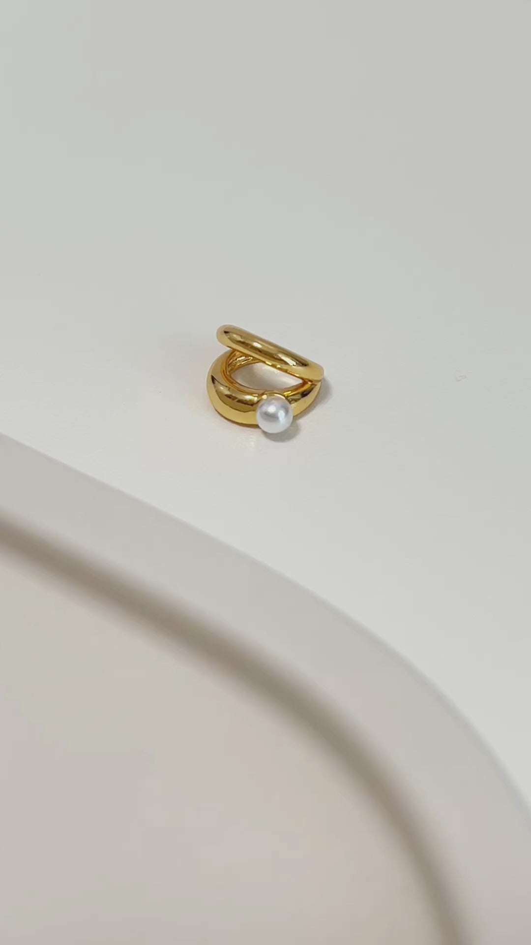 Gold ear cuff earring with a pearl