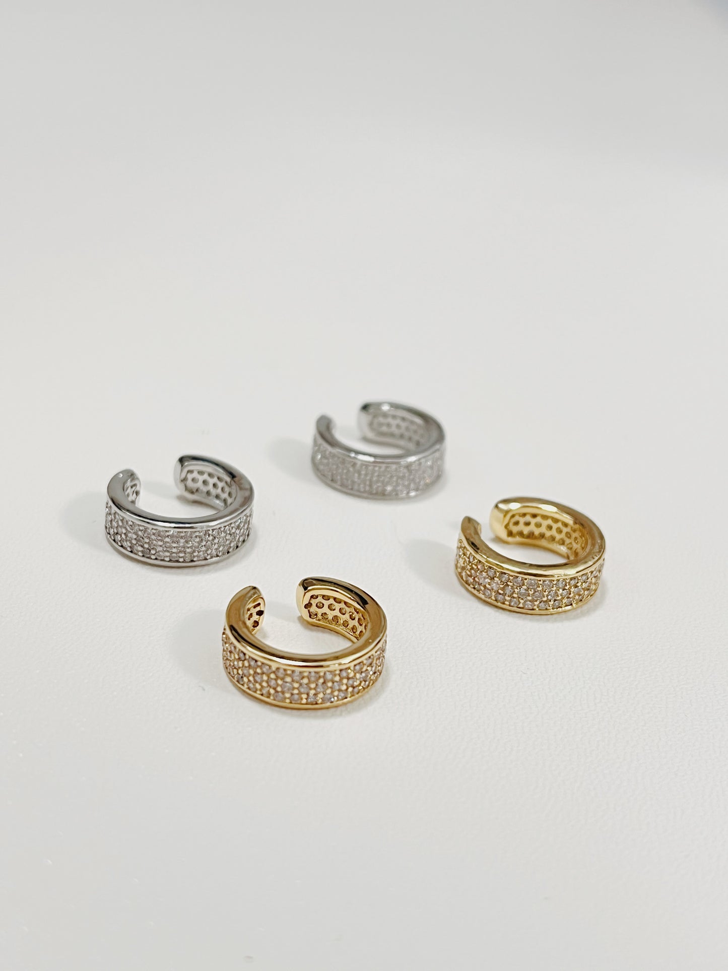 Silver and Gold Thick Pave Ear Cuff with cubic zirconia stones top down view.
