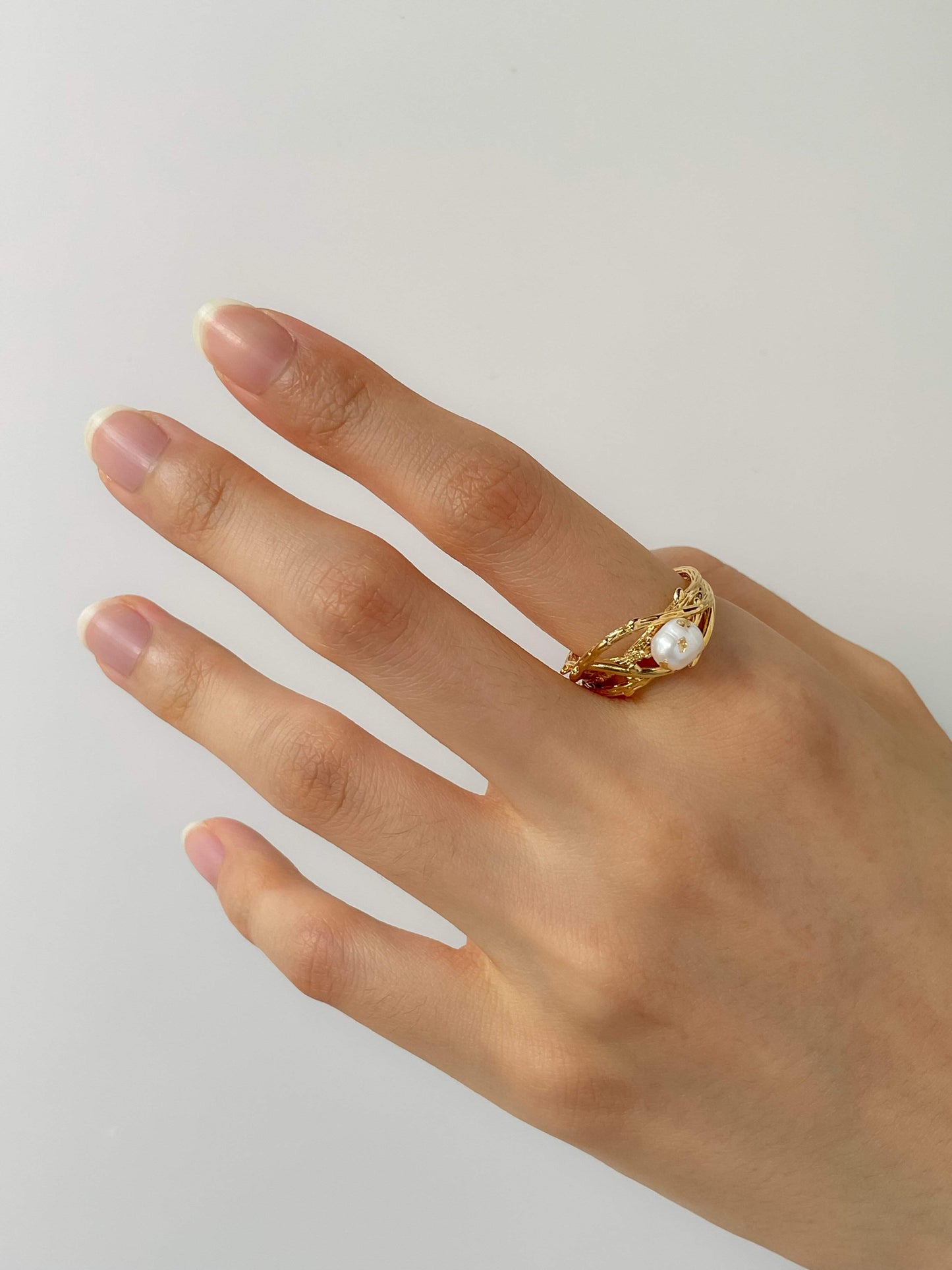 Hand model showcasing the satiny glow of the Lorna freshwater pearl