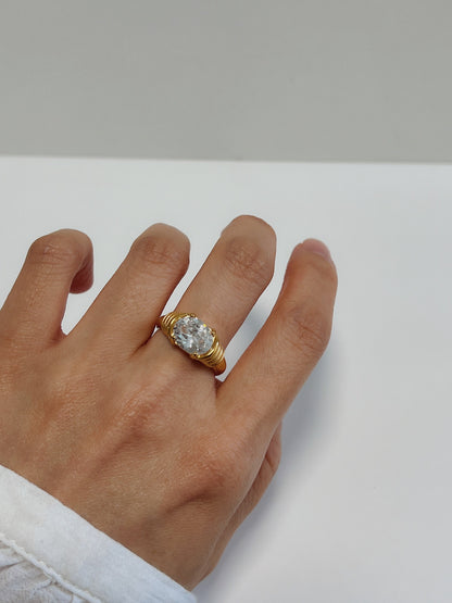 Lifestyle photography of a hand model wearing the Chiara ring
