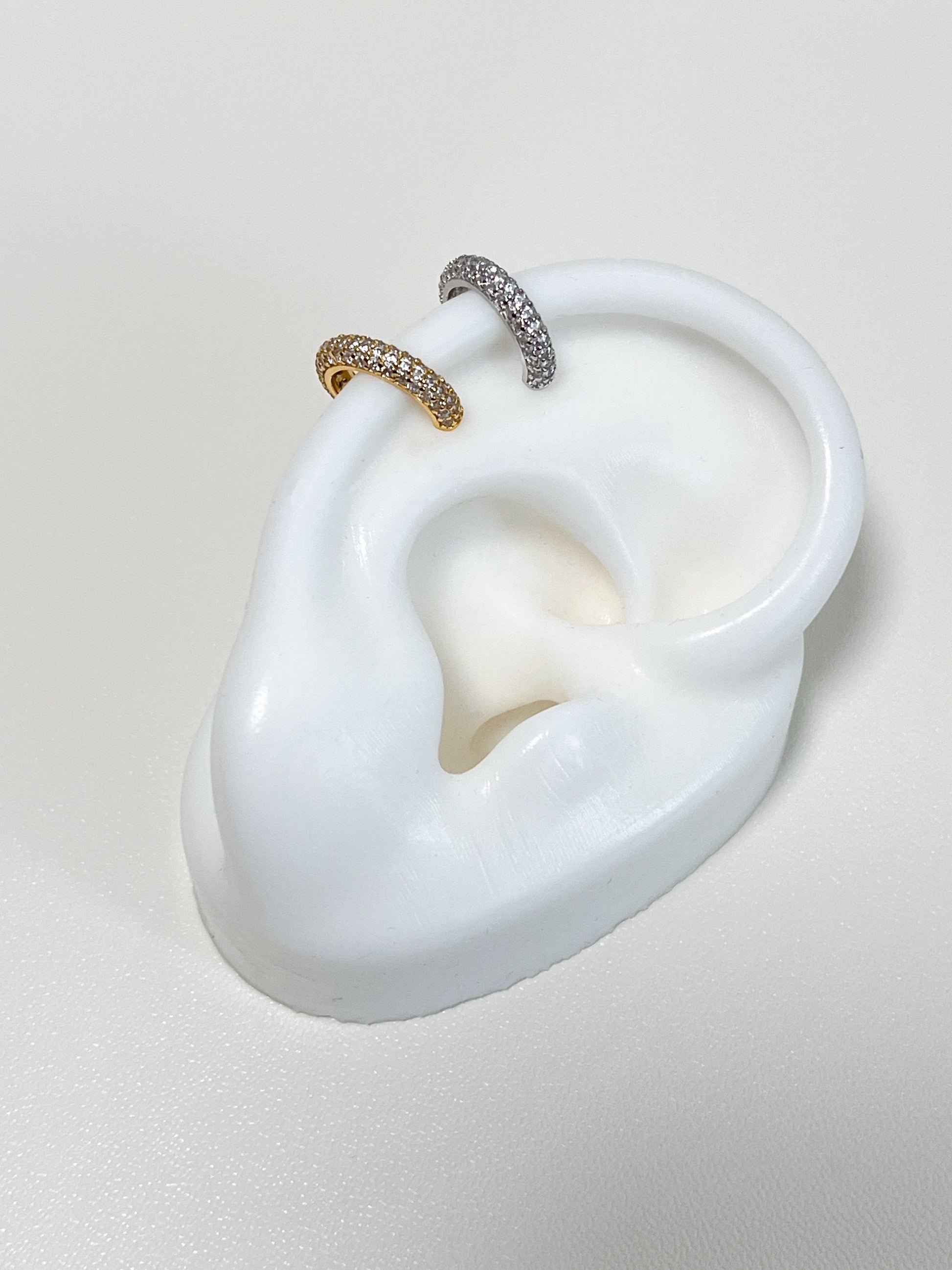 Close-up of a white's fake ear showing the Rose Pavé Cuff