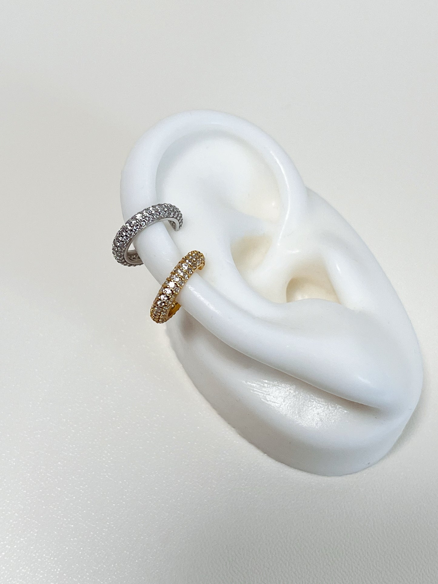Ears wearing the Rose Pavé Ear Cuff in a professional setting, illustrating its versatility as a daily luxury essential.