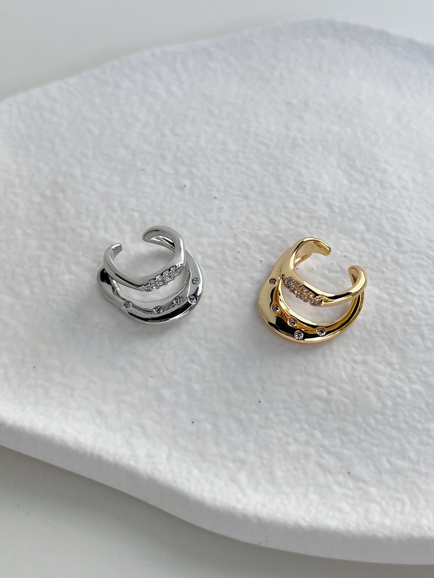 Close-up of wavy liquid-metal band on the Ashley Gold and silver Cuff.