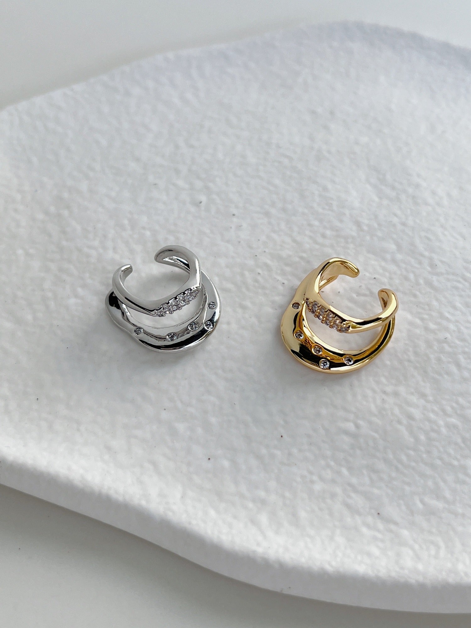 Close-up of wavy liquid-metal band on the Ashley Gold and silver Cuff.