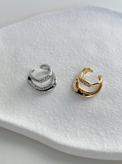 Close-up of wavy liquid-metal band on the Ashley Gold and silver Cuff.