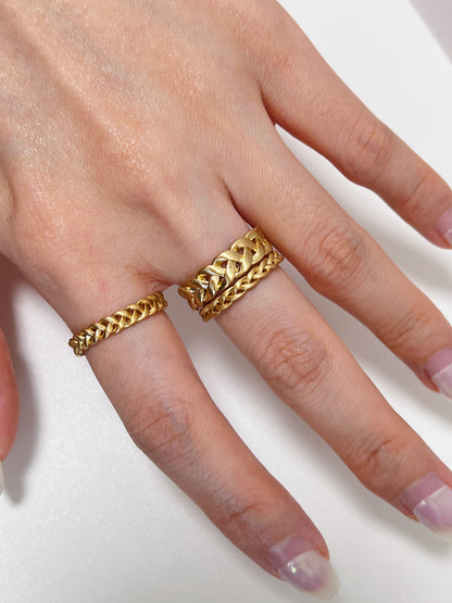 Stacked view of the 3mm and 6mm gold Irene rings on middle finger and 4mm on index finger showing the brushed matte finish.