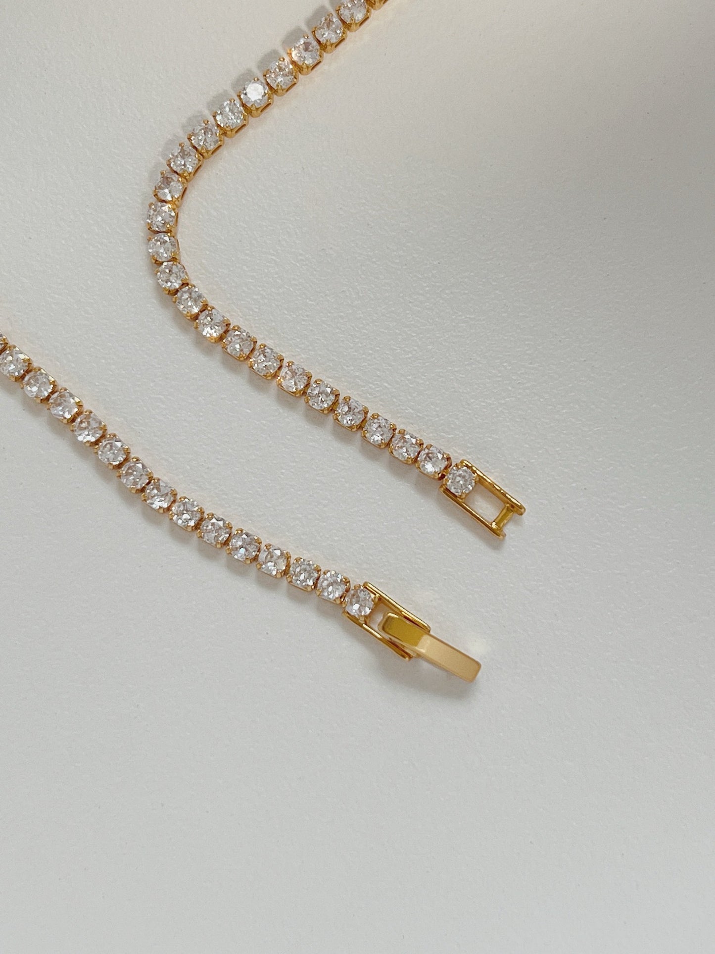 Fine jewelry alternative chain layout highlighting low profile custom flip-over clasp closure parts