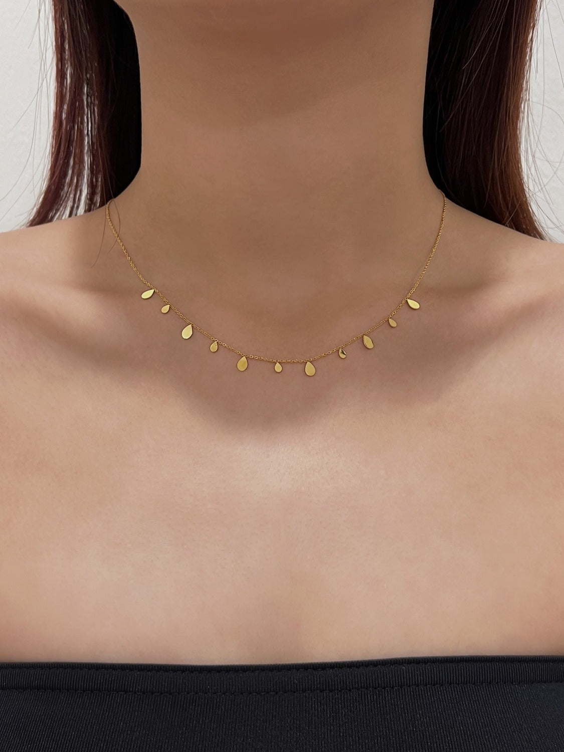 Lifestyle view of comfortable non irritating daily wear teardrop pendant for sensitive skin
