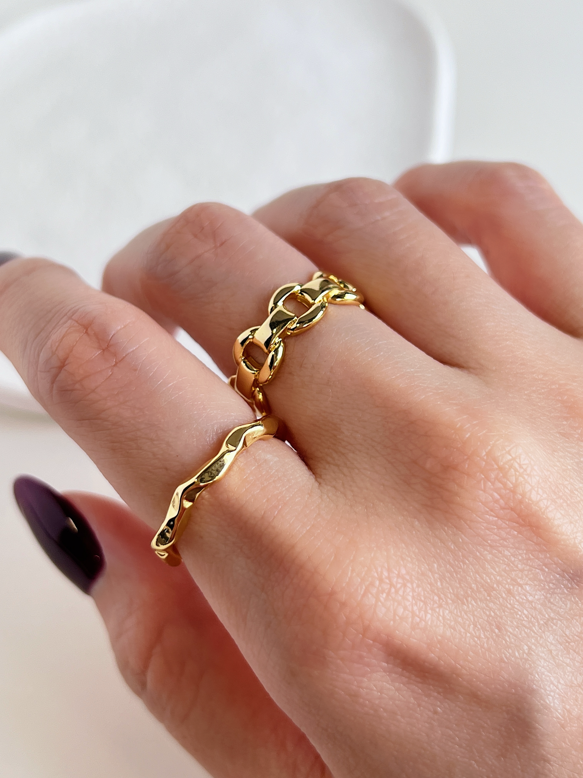 Model styling the adjustable Zelda Link Ring on the middle finger pairing with Marina Minimalist Irregular Ring on index finger