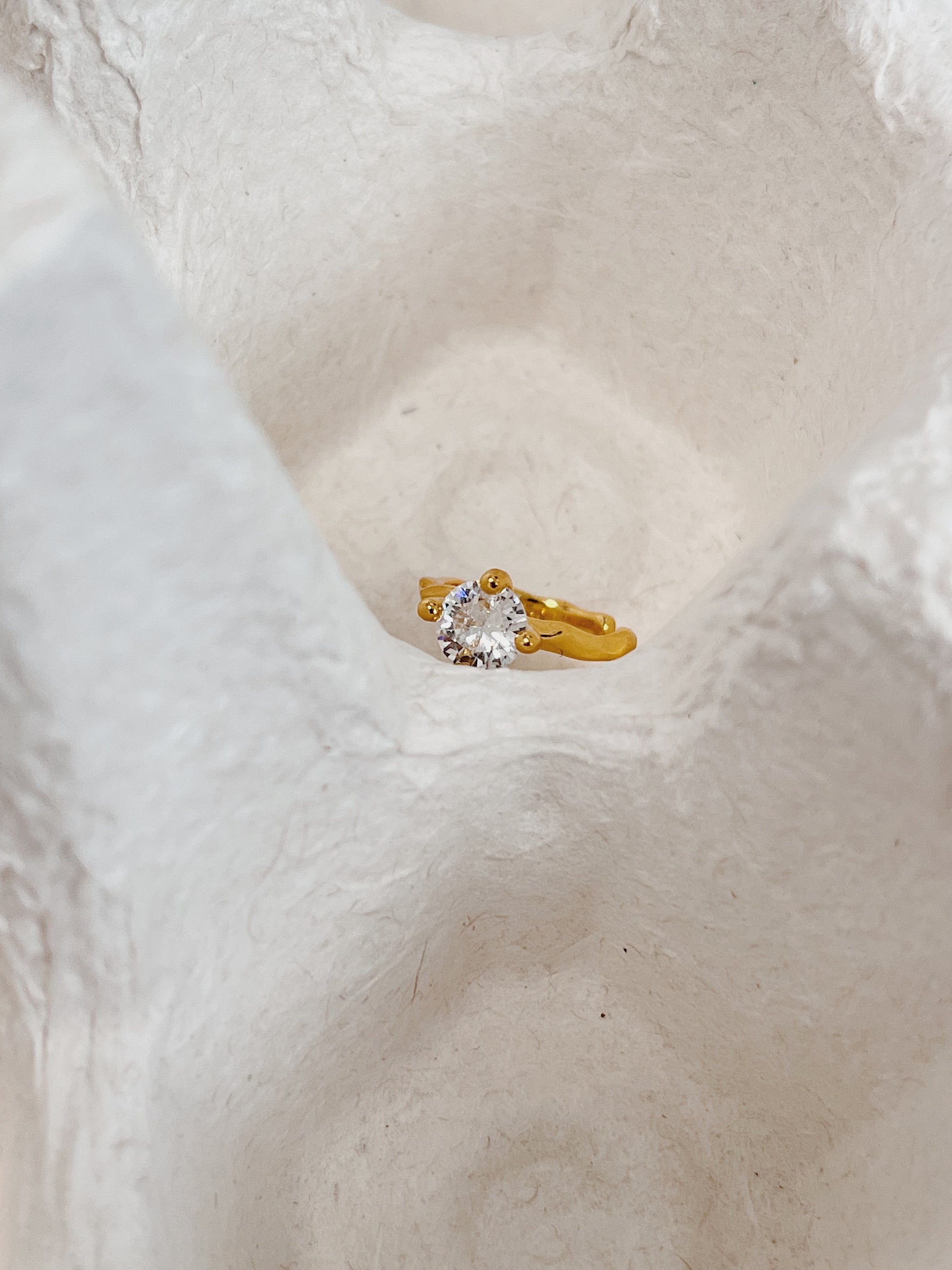 Top-down view of dainty gold vermeil cuff.