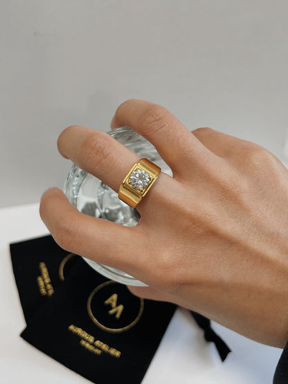 Model gesturing showing the comfortable fit of the chunky gold signet.