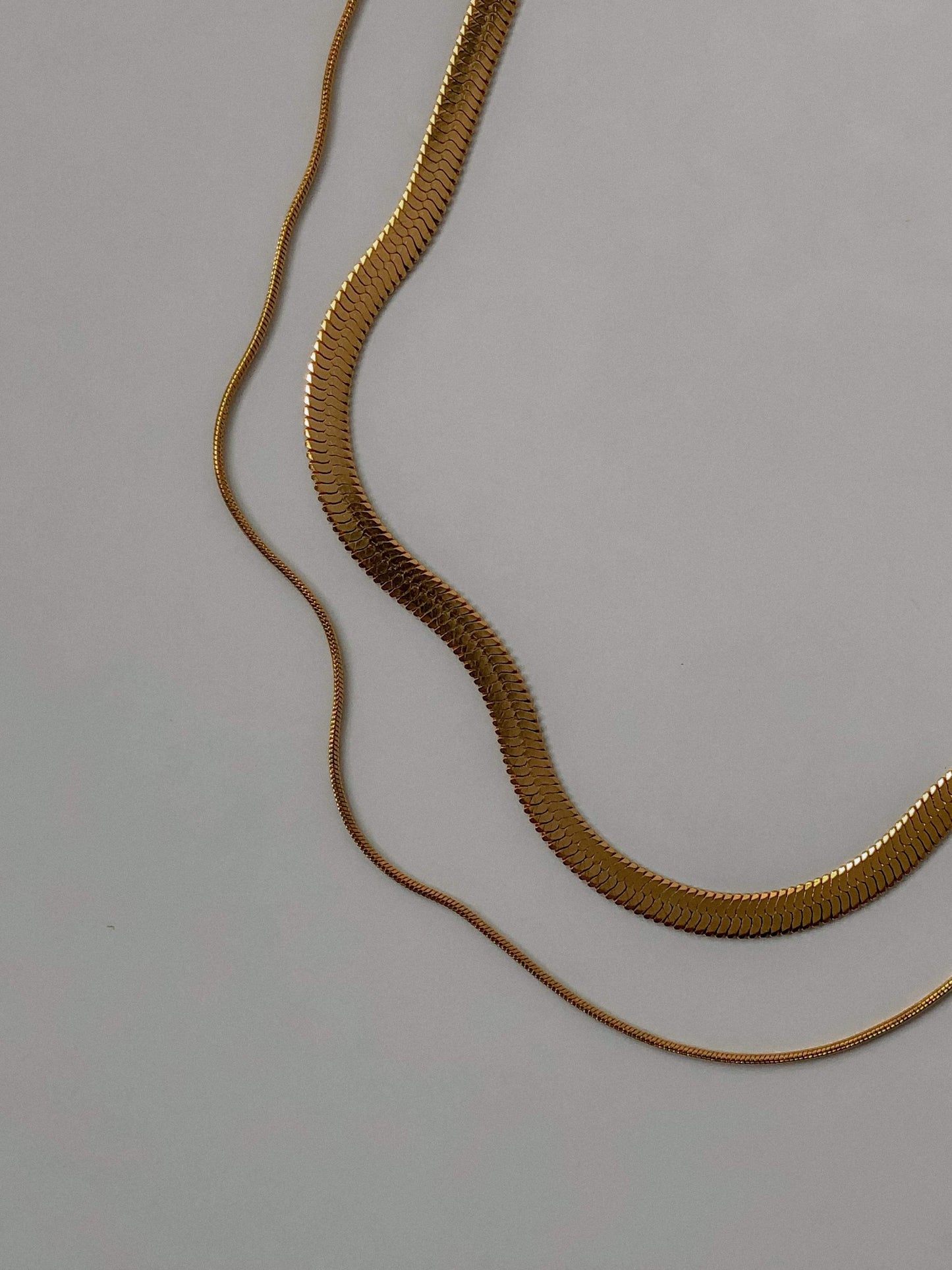 Front view of hypoallergenic solid stainless steel core pre layered flat herringbone jewelry
