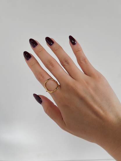 Dainty gold jewellery trends 2026 styled on model's manicured hand