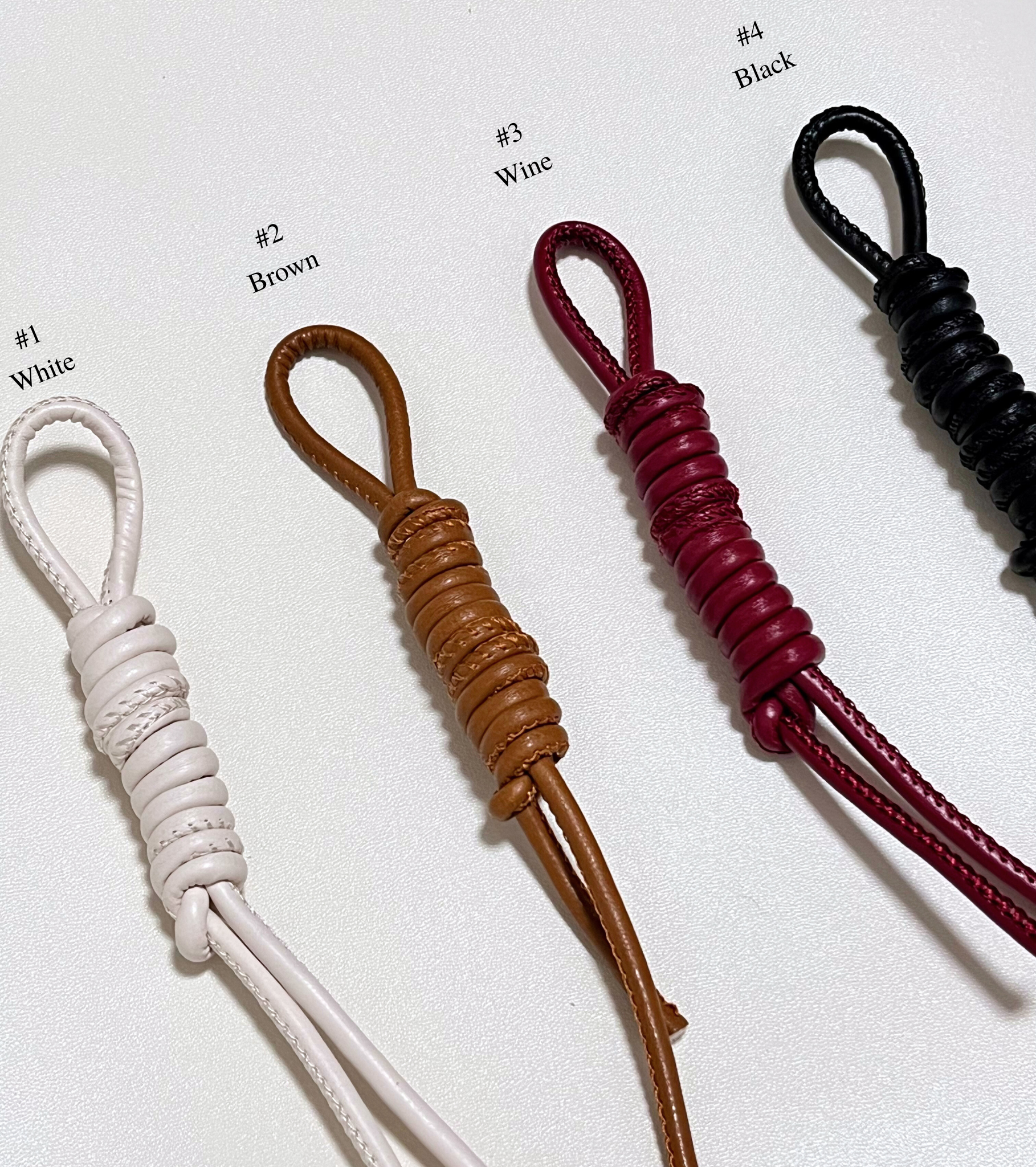 Four leather straps in different colors for personalized option.
