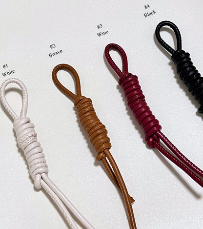 Four leather straps in different colors for personalized option.
