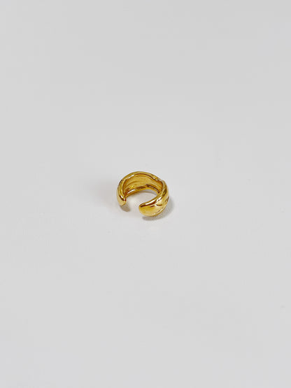 Detailed view of the PVD gold finish on the interior of the lyon brass ear cuff.
