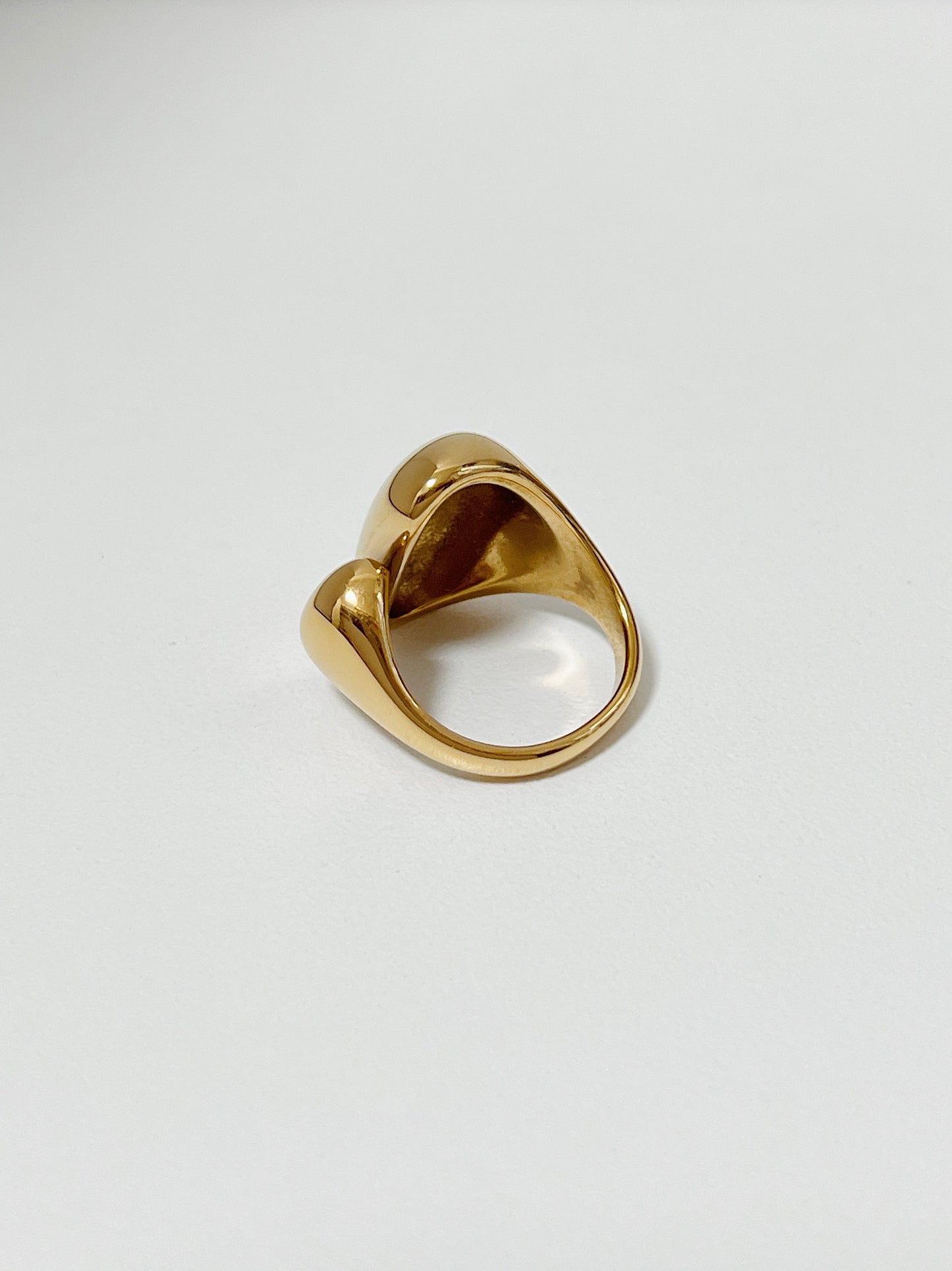 Chunky gold rings for women highlighting the mirror-shine finish