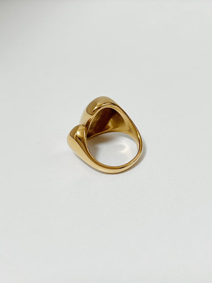 Chunky gold rings for women highlighting the mirror-shine finish