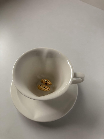 High-shine gold croissant ring with weighted luxury heft