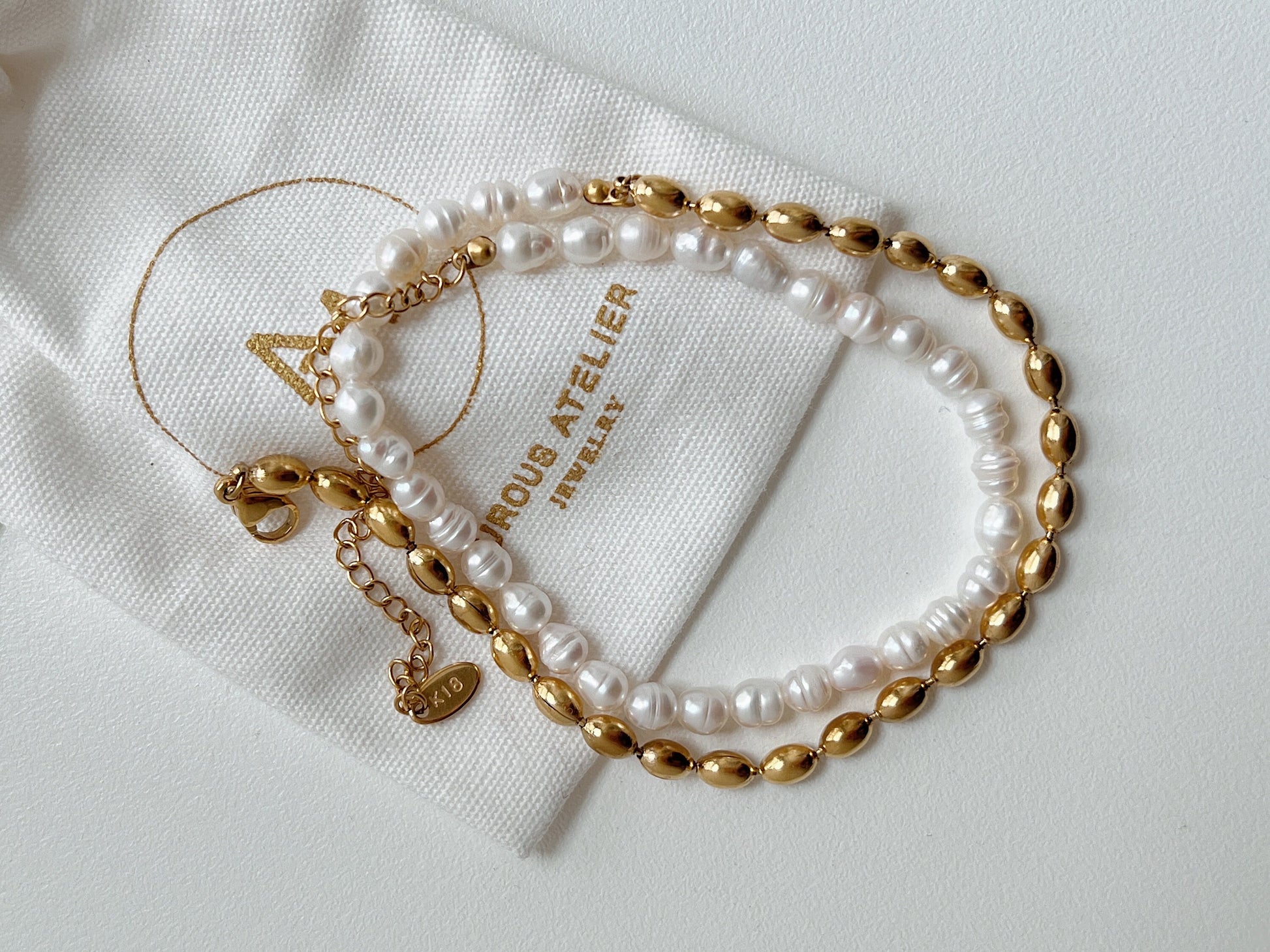 Front view of hypoallergenic warm yellow gold PVD bead and natural gemstone jewelry