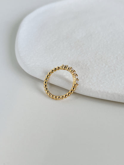 Close up of 18k gold pvd brass core eternity ring showing thin beaded details