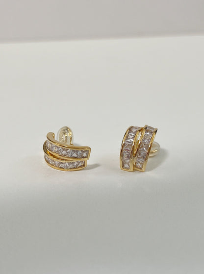 Curved 15mm C-silhouette profile of Tiana princess cut gold clip-on earring