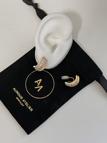 Tiana princess cut CZ clip-on earrings presented on top of luxury Aurous Atelier brand jewelry pouch