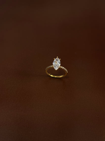 Top-down view of marquise moissanite ring showing light refraction.