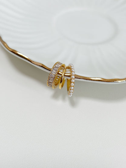 Side view of 18k gold PVD triple band ear cuff.