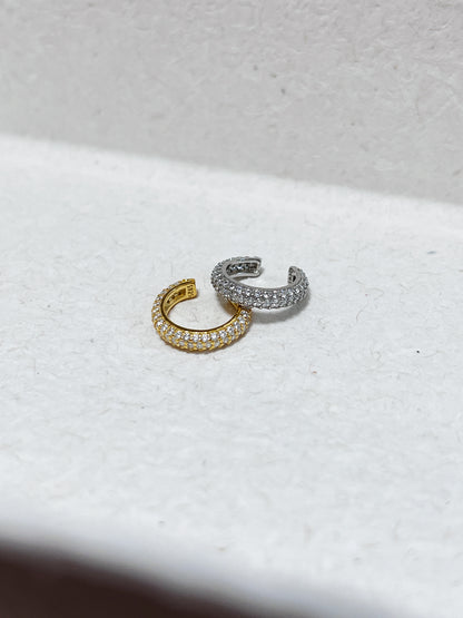 Comparison shot of the gold and silver Rose cuffs showing the pavé density.