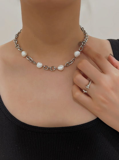 Woman neck showing the fluid lay flat drape of organic freshwater pearls