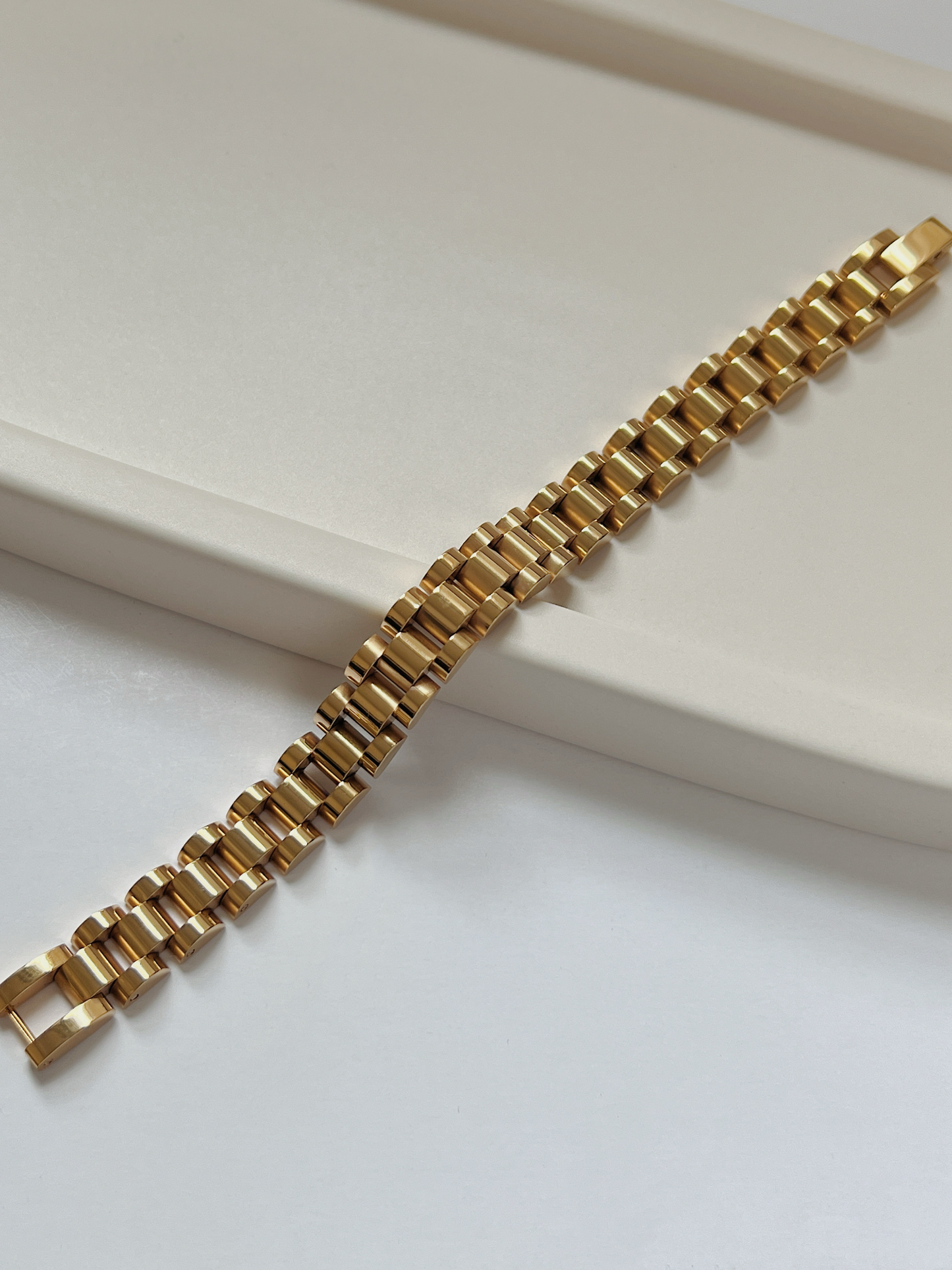 The Spencer 18K gold watch band chain bracelet showcasing liquid gold mirror luster.
