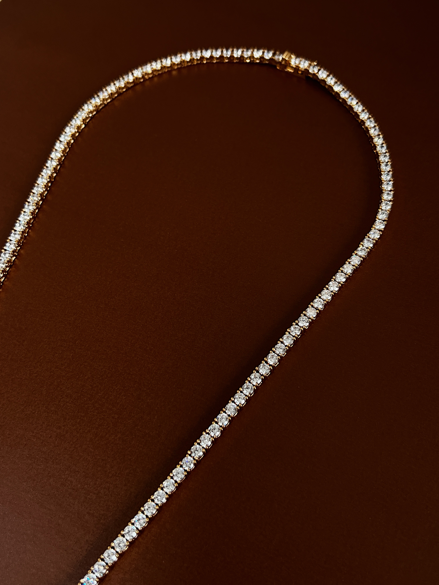 Close up of high quality gold vacuum plated four prong stone setting links