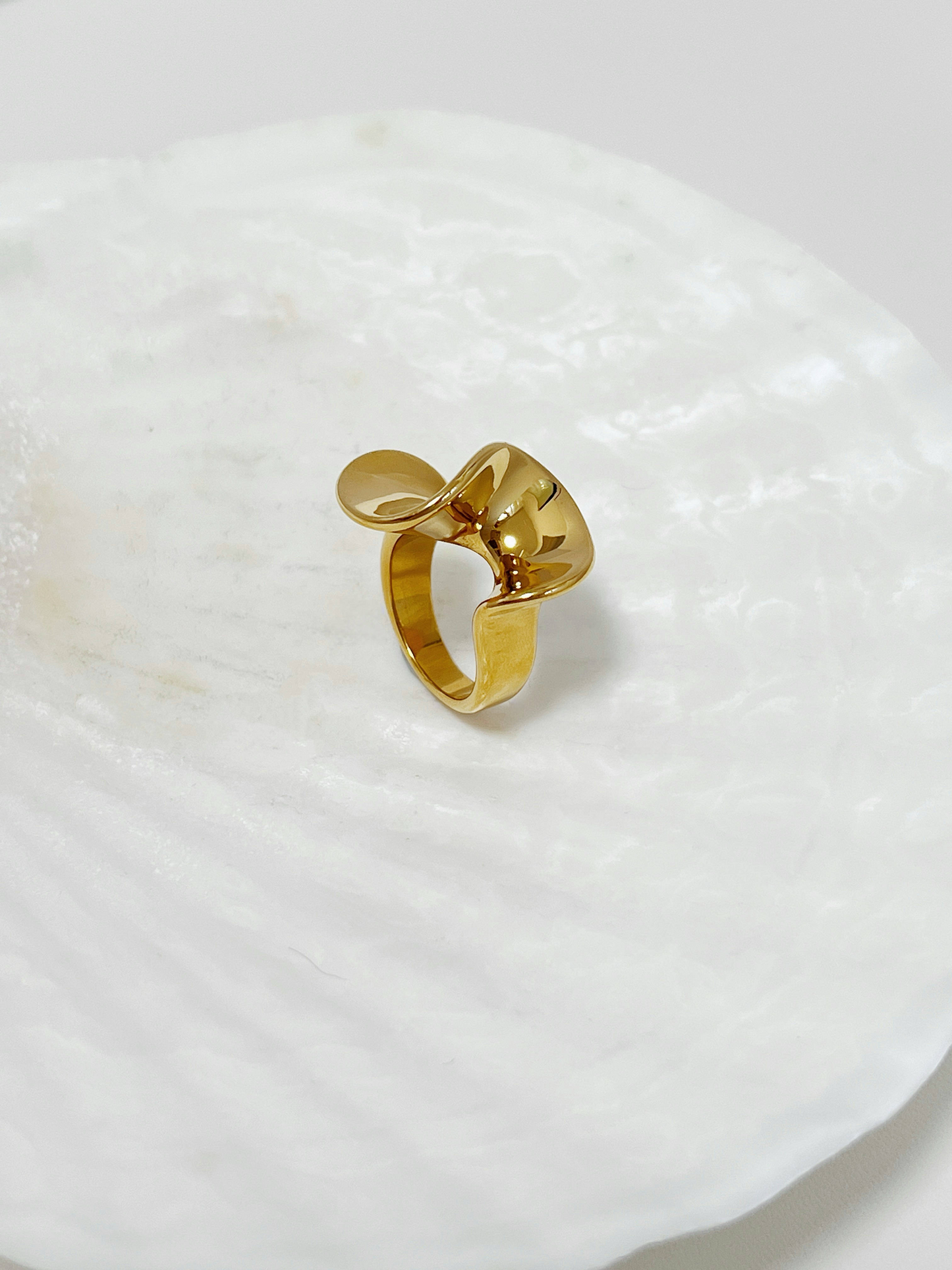 Chunky gold rings for women highlighting the continuous undulating finish