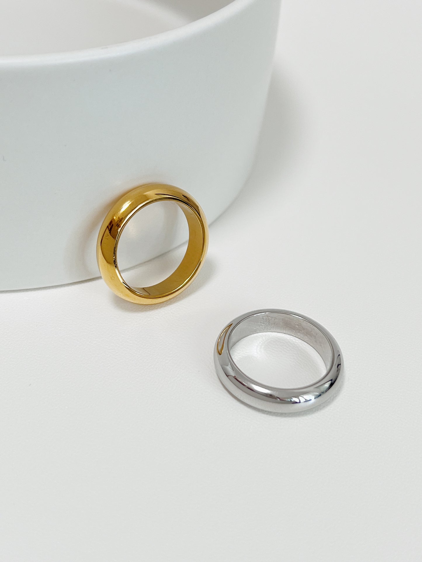 Dainty gold and silver rings for women featuring a fixed profile